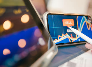 Trader analysing Bitcoin, Ethereum, and forex options across multiple markets